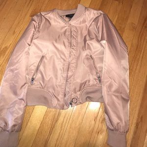 A light rose pink bomber jacket